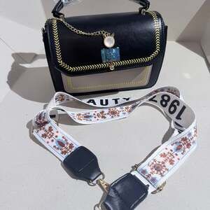 Black and gold women‘s backpack/handbag